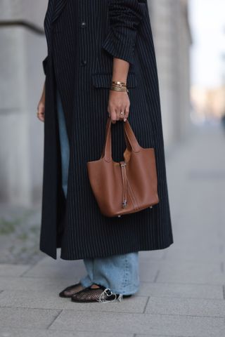 Alaia mesh flats worn by a guest at new york fashion week