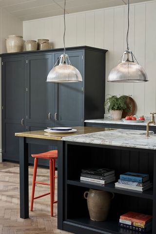 blue kitchen with pendant lamps