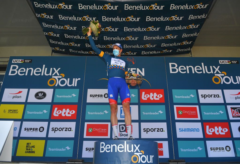 BILZEN BELGIUM SEPTEMBER 03 Stefan Kng of Switzerland and Team Groupama FDJ celebrates winning the blue leader jersey on the podium ceremony after the 17th Benelux Tour 2021 Stage 5 a 188km stage from Riemst to Bilzen BeneluxTour on September 03 2021 in Bilzen Belgium Photo by Luc ClaessenGetty Images