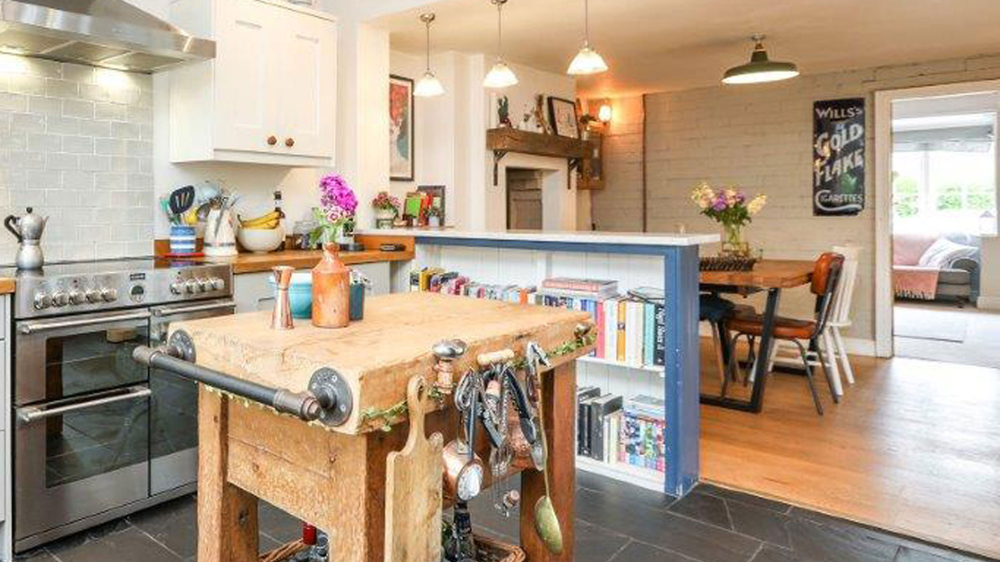 open plan kitchen diner with slate floor and butchers block