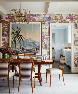 Dining room with round table and wallpaper