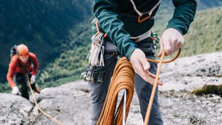 Two climbers trad climbing