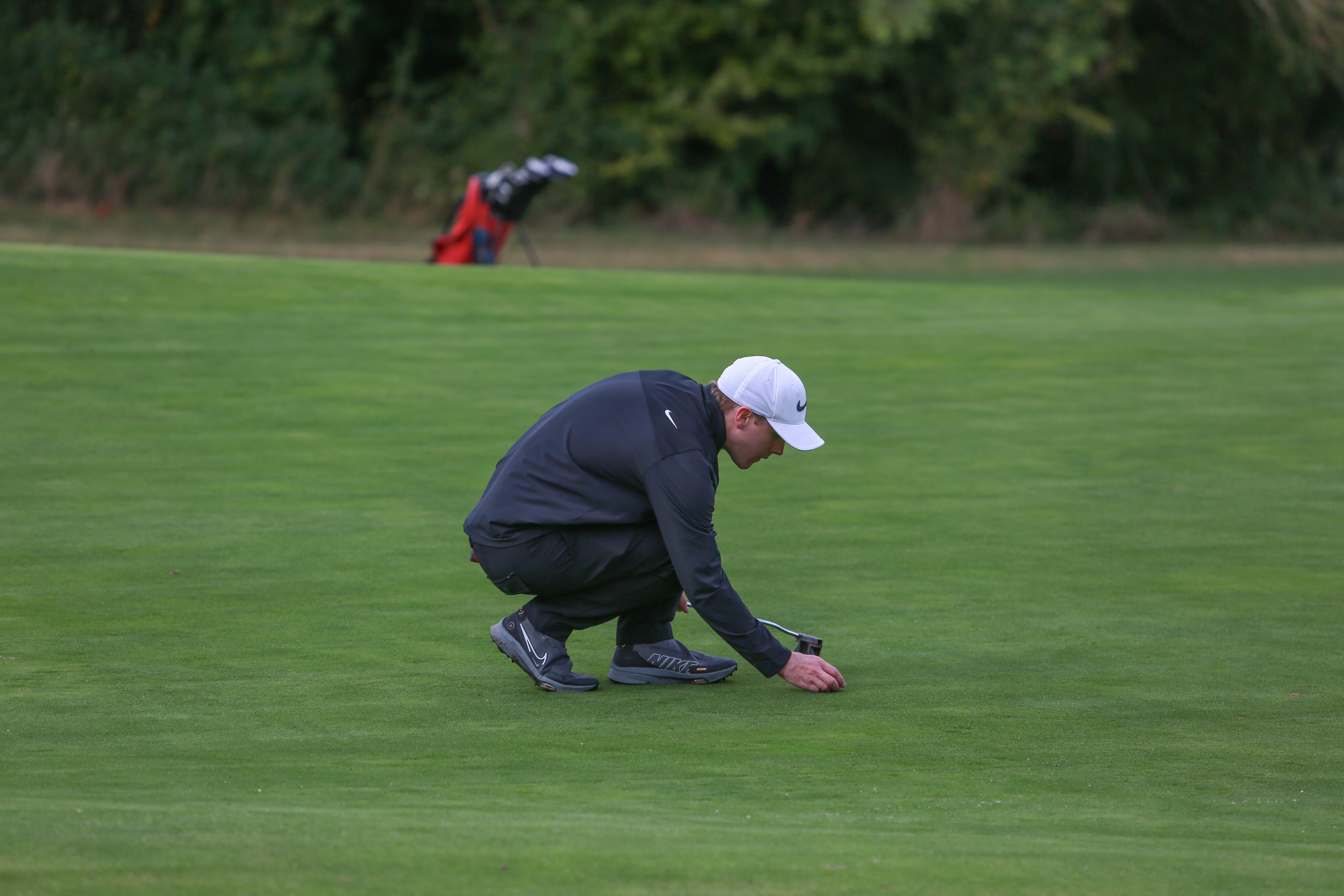 Jonny Leighfield lines up a putt during the Golf Monthly Autumn/Winter Test Day at Effingham Golf Club