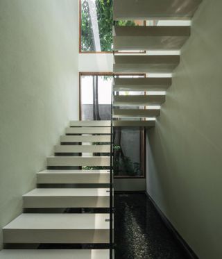 Open tread stairs in tropical home