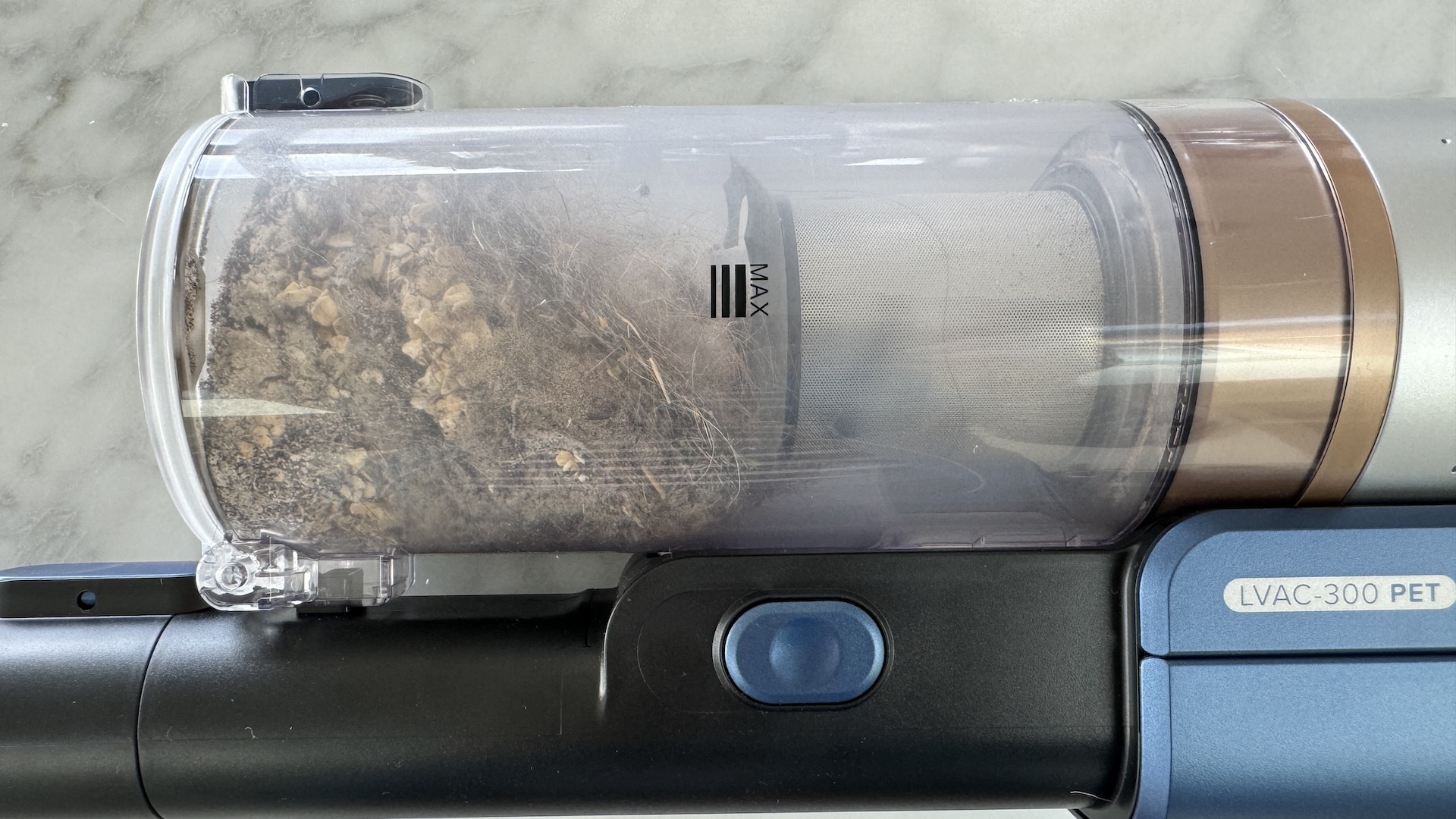 Close up of full dust cup on Levoit LVAC-300 vacuum