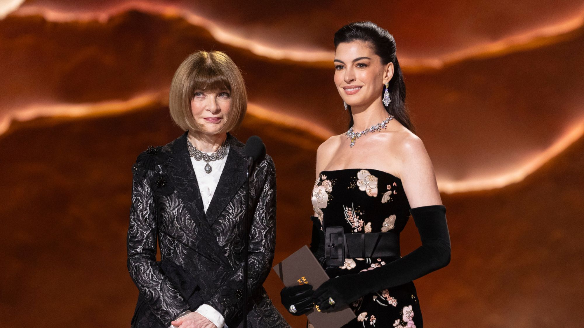 Anna Wintour and Anne Hathaway on stage at the 2026 Oscars