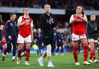 eah Williamson of Arsenal, wearing a knee support for their ACL injury, acknowledges the fans as they walk with players of Arsenal after their side's defeat to VfL Wolfsburg during the UEFA Women's Champions League semi-final 2nd leg match between Arsenal and VfL Wolfsburg at Emirates Stadium on May 01, 2023 in London, England.