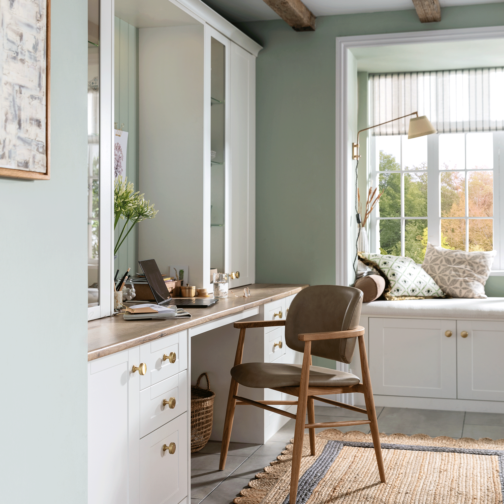 Green bedroom with desk and wooden chair