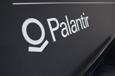 Palantir logo in white lettering with a black background