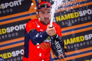 Sonny Colbrelli celebrates his win on the Gran Piemonte podium