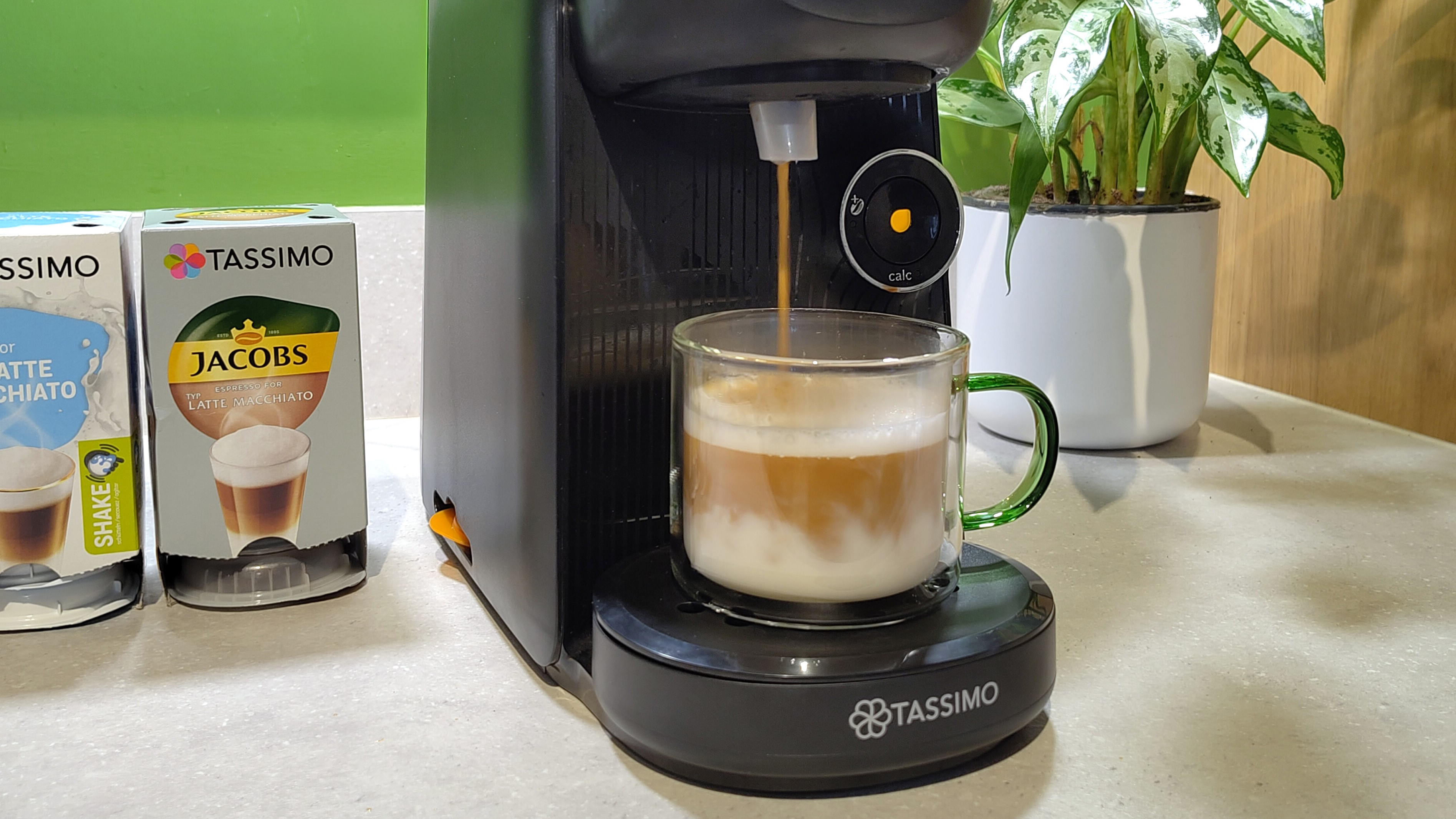 Bosch Tassimo Finesse Friendly coffee maker dispensing coffee into caffe latte