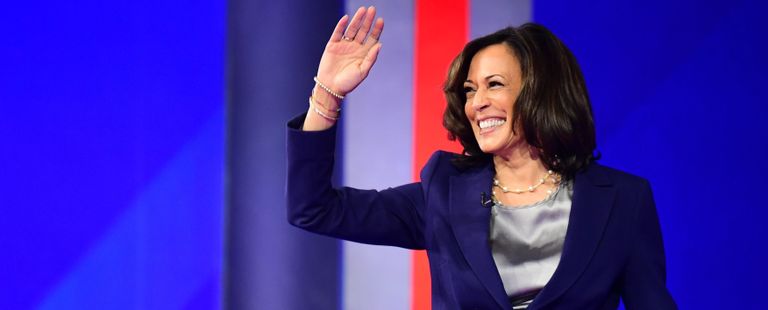 Democratic presidential hopeful California Senator Kamala Harris waves as she arrives onstage for the third Democratic primary debate of the 2020 presidential campaign season
