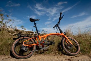 Brompton G Line parked to the side of gravel track