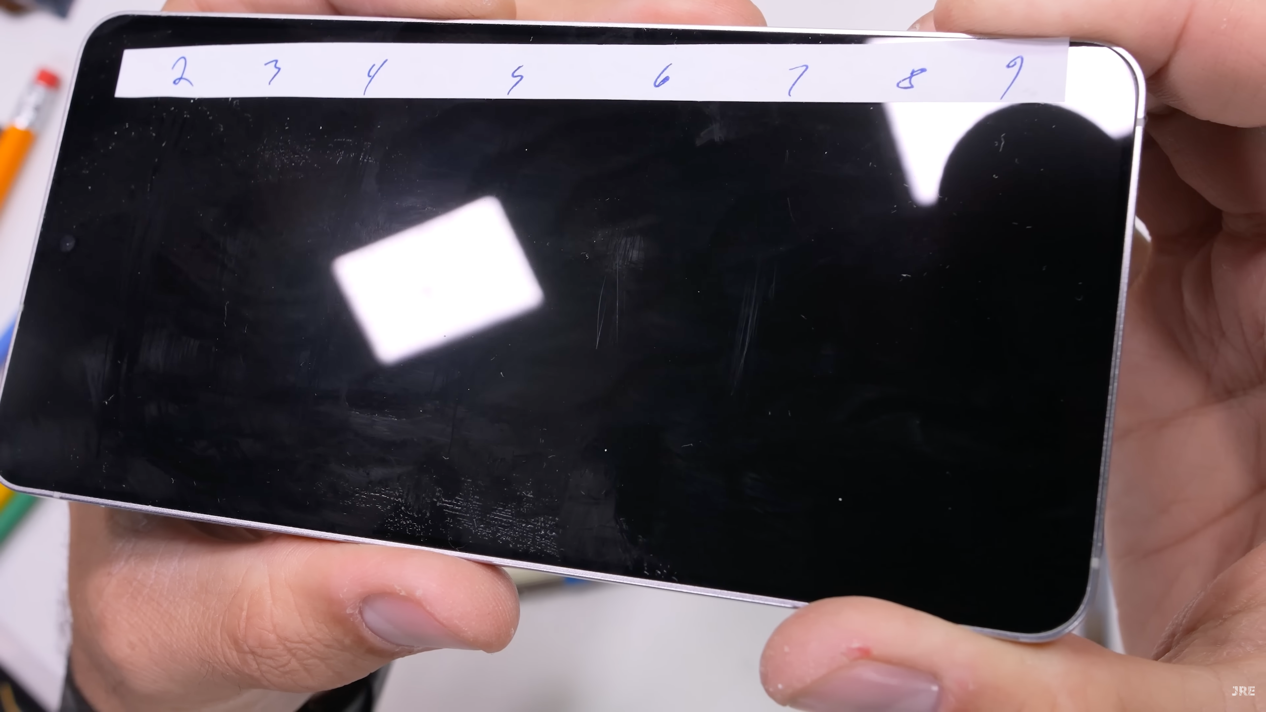 Galaxy S25 Edge durability test by JerryRigEverything, showing the display being after scratched by several mineral picks