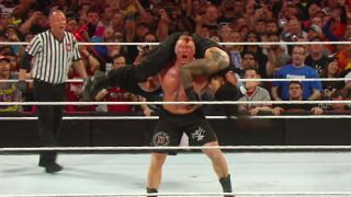 Brock Lesnar putting Roman Reigns in the F5 at WrestleMania 31