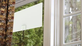 The Mohu Leaf Supreme Pro attached to a window.