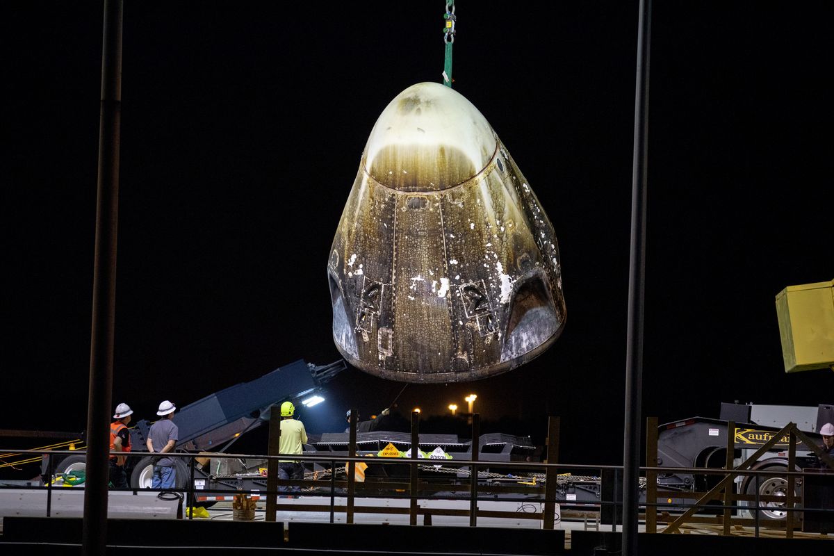 The Crew Dragon Demo-1 capsule looks pretty charred as it returns to shore on SpaceX&#039;s recovery ship after ending its mission to the International Space Station with a splashdown in the Atlantic Ocean on March 8, 2019. This was before it exploded during an engine test on April 20, 2019. 