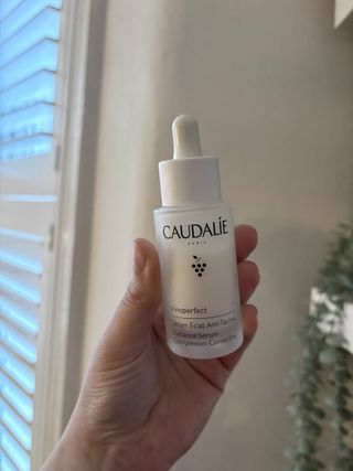 Mica Ricketts holding Caudalie Vinoperfect Brightening Dark Spot Serum