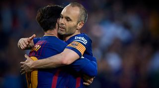 Lionel Messi and Andres Iniesta of Barcelona embrace during the La Liga match between Barcelona and Villarreal on 9 May, 2018 at Camp Nou, Barcelona, Spain