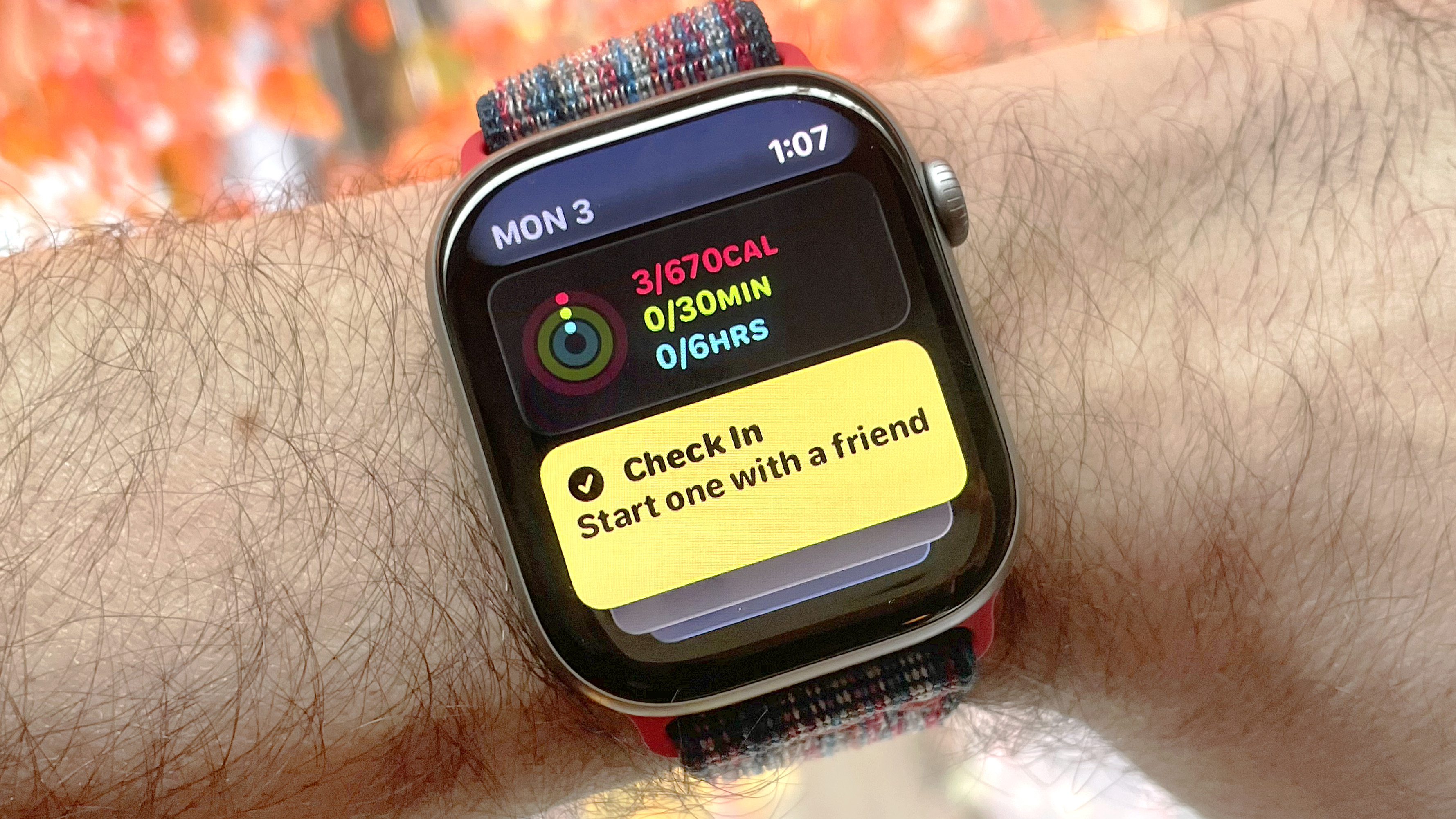 Detail shot of an Apple Watch Series 11 showing the steps to set up and send a Check In safety notification in watchOS 26