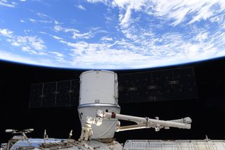 SpaceX's last Dragon cargo ship to be captured by a robotic arm is parked at the International Space Station's Harmony module on March 9, 2020.