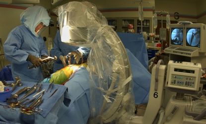 Hip replacement surgery at Shawnee Mission Medical Center in Merriam, Kan. Oct. 8, 2003.