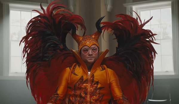 Rocketman Elton sits in group therapy in his devil costume