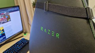 Razer Iskur V2 chair seen from behind, with a prominent Razer logo on its back