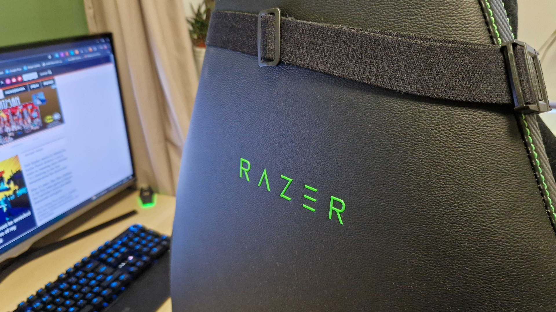 Razer Iskur V2 chair seen from behind, with a prominent Razer logo on its back