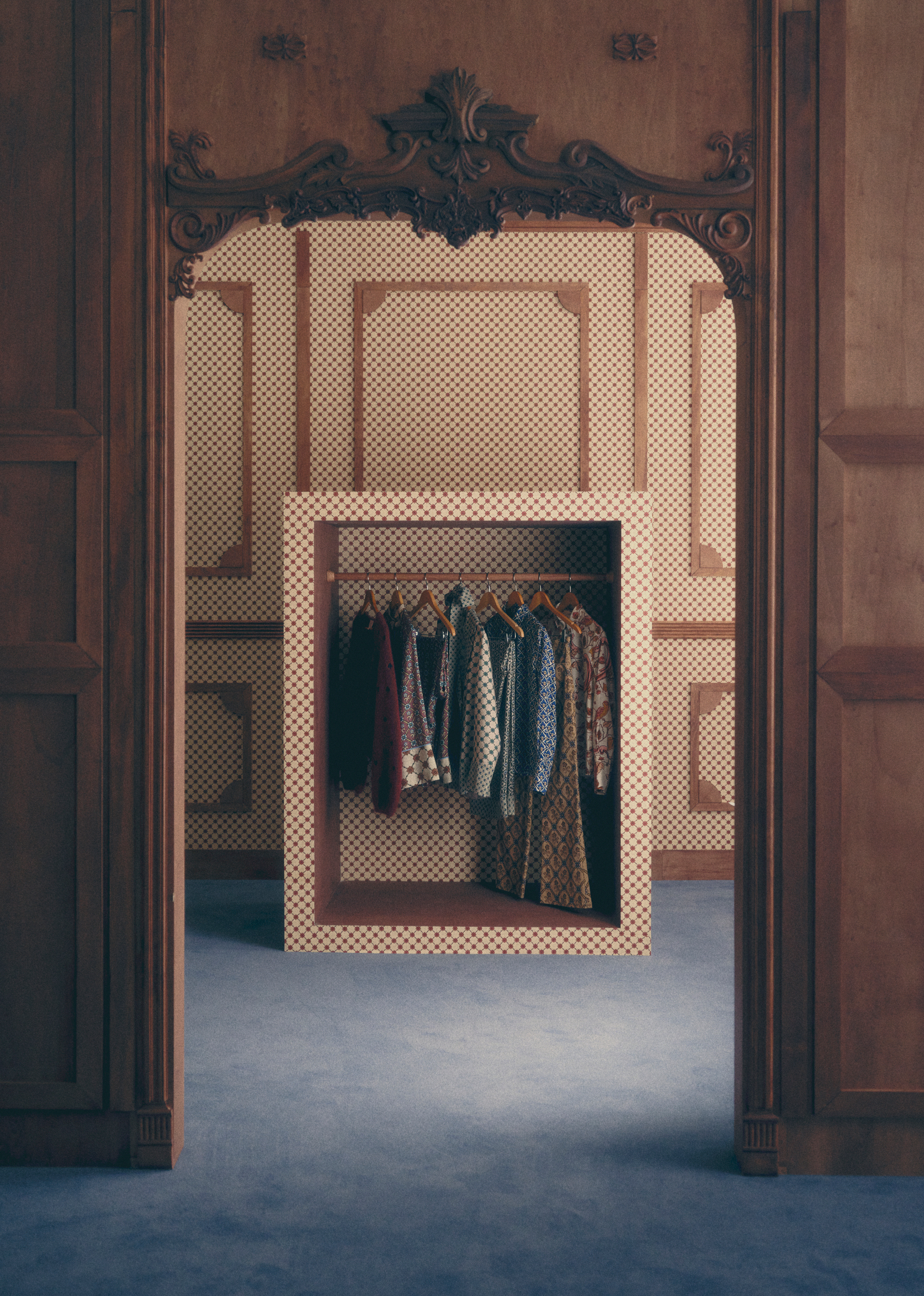 a closet filled with the new sezane collaboration in a wood paneled apartment
