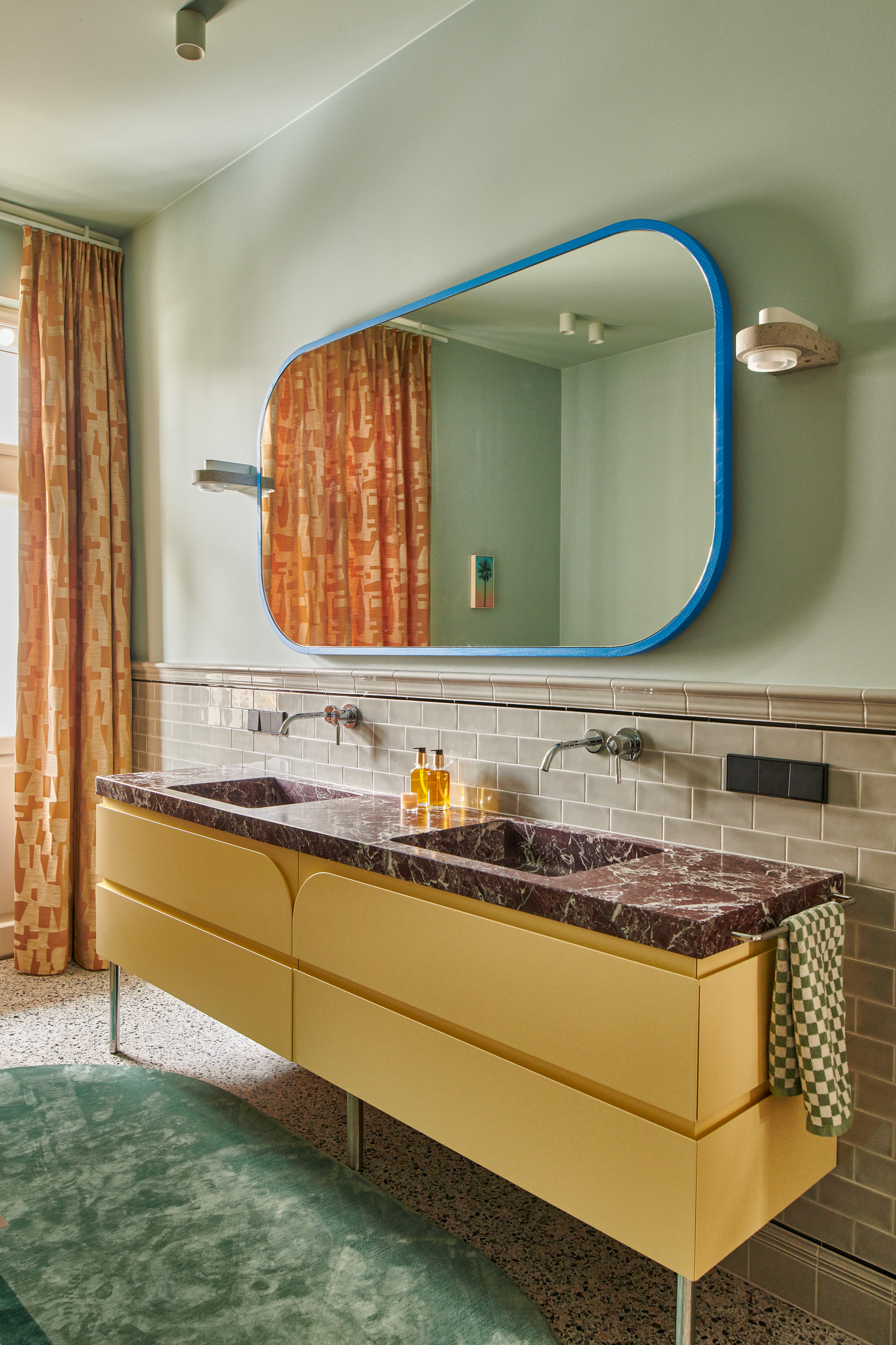 Green bathroom with yellow vanity