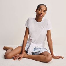 a model wearing a tshirt from the uniqlo anya hindmarch collaboration