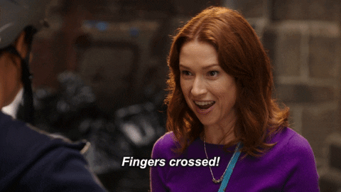The Unbreakable Kimmy Schmidt crosses her fingers and says fingers crossed.