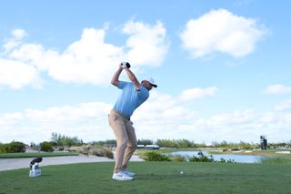 Scottie Scheffler at the top of his backswing