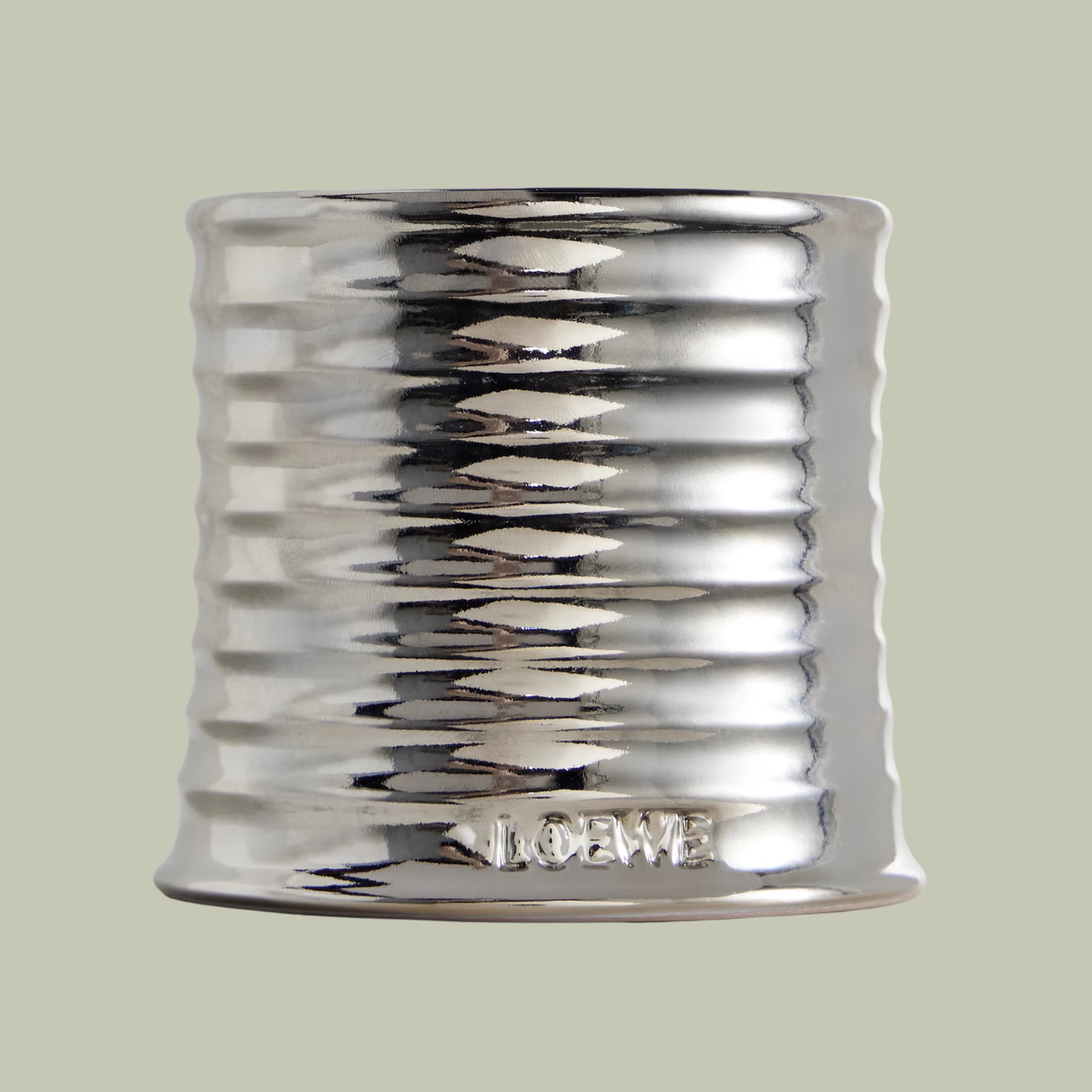 A textured silver candle