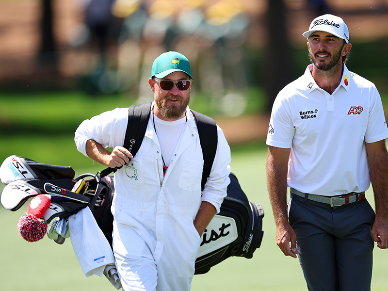 Max Homa walking the golf course with his caddie at The Masters