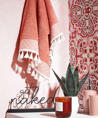 Get naked bathroom sign with coral and red soft furnishings by B&M