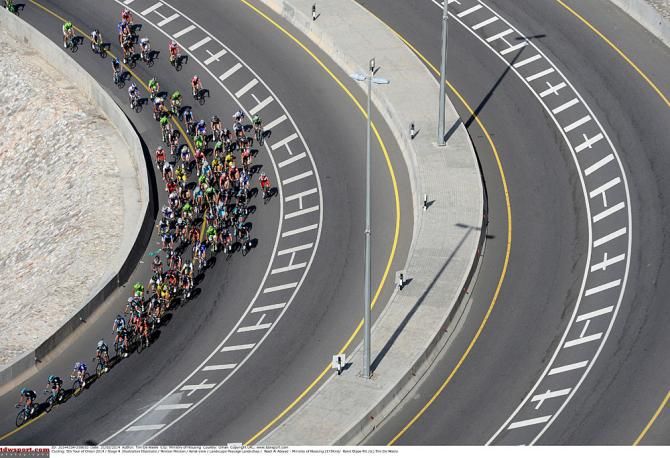 The peloton rounds a bend