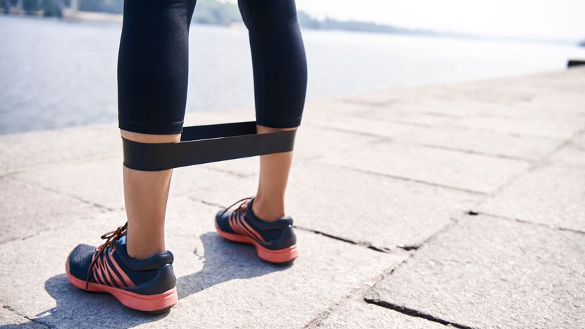 Close up of resistance band around runner&#039;s legs