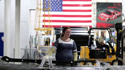 Worker on a car production line