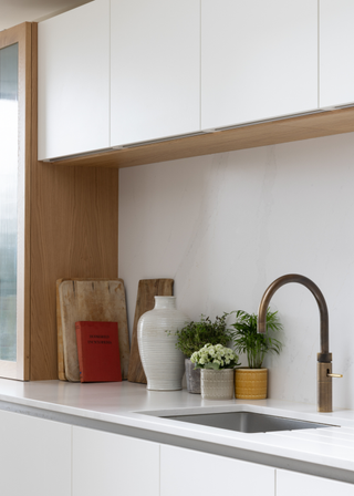 white kitchen with a hot water tap