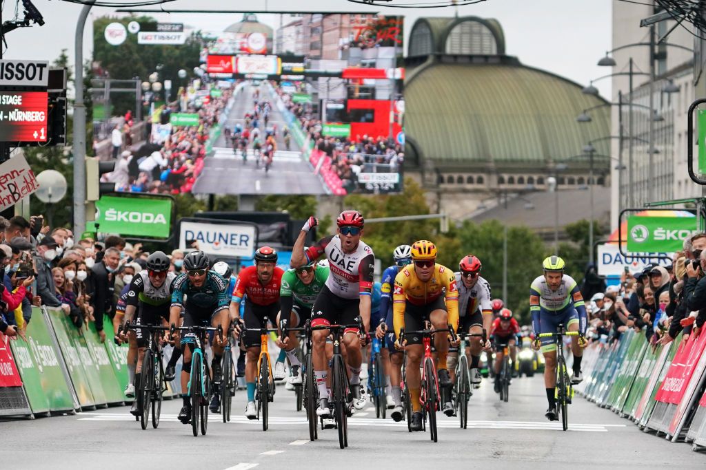NUREMBERG GERMANY AUGUST 29 Alexander Kristoff of Norway and UAE Team Emirates celebrates winning ahead of Pascal Ackermann of Germany and Team Bora Hansgrohe Luca Mozzato of Italy and Team BB Hotels PB KTM Francisco Kiko Galvn Fernndez of Spain and Team Equipo Kern Pharma and Marco Haller of Austria and Team Bahrain Victorious during the 35th Deutschland Tour 2021 Stage 4 a 1563km stage fro Erlangen to Nrnberg DeineTour on August 29 2021 in Nuremberg Germany Photo by Christian KasparBartkeGetty Images