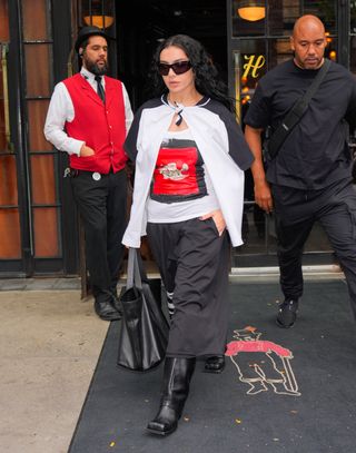 Charli XCX wears the Saint Laurent Y Bag.