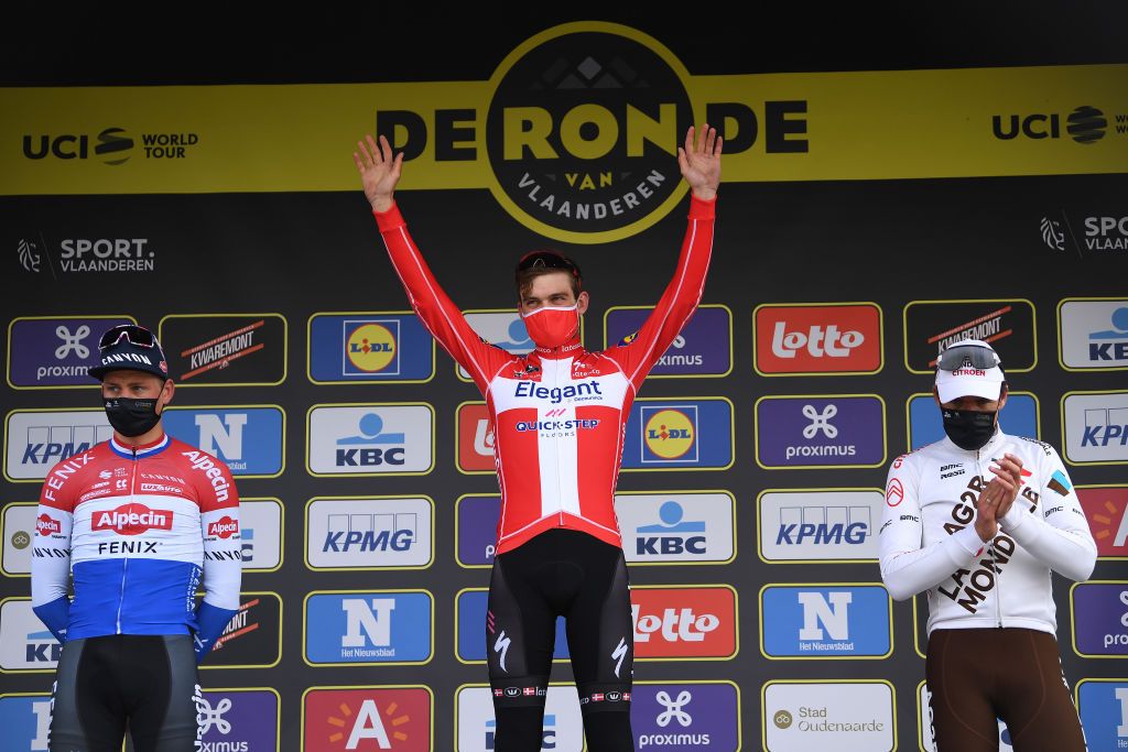 OUDENAARDE BELGIUM APRIL 04 Podium Mathieu Van Der Poel of Netherlands and Team AlpecinFenix Kasper Asgreen of Denmark and Team Deceuninck QuickStep Greg Van Avermaet of Belgium and Team AG2R Citren Team Celebration during the 105th Ronde van Vlaanderen Tour of Flanders 2021 Mens Elite a 2515km race from Antwerp to Oudenaarde Mask Covid Safety Measures RVV21 rondevanvlaanderen tourofflanders on April 04 2021 in Oudenaarde Belgium Photo by Tim de WaeleGetty Images