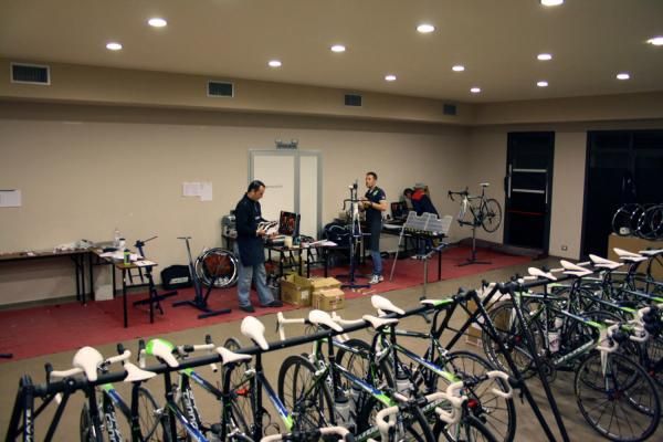 Three mechanics were busy building the team's race bikes