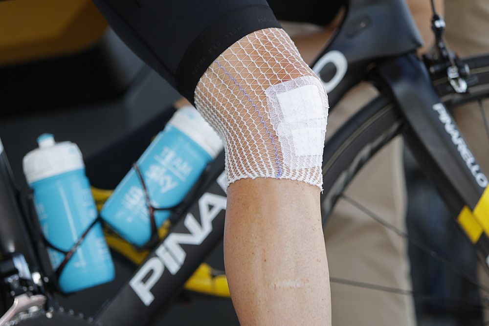 Chris Froome (Team Sky) bandaged up after crashing the previous day's stage 19