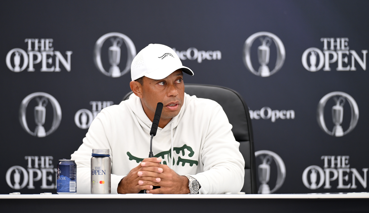 Tiger Woods speaks into a microphone at The Open