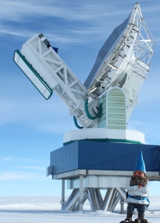 Kern the gnome in front of the South Pole Telescope (SPT), located at the Amundsen-Scott South Pole Station, Antarctica.