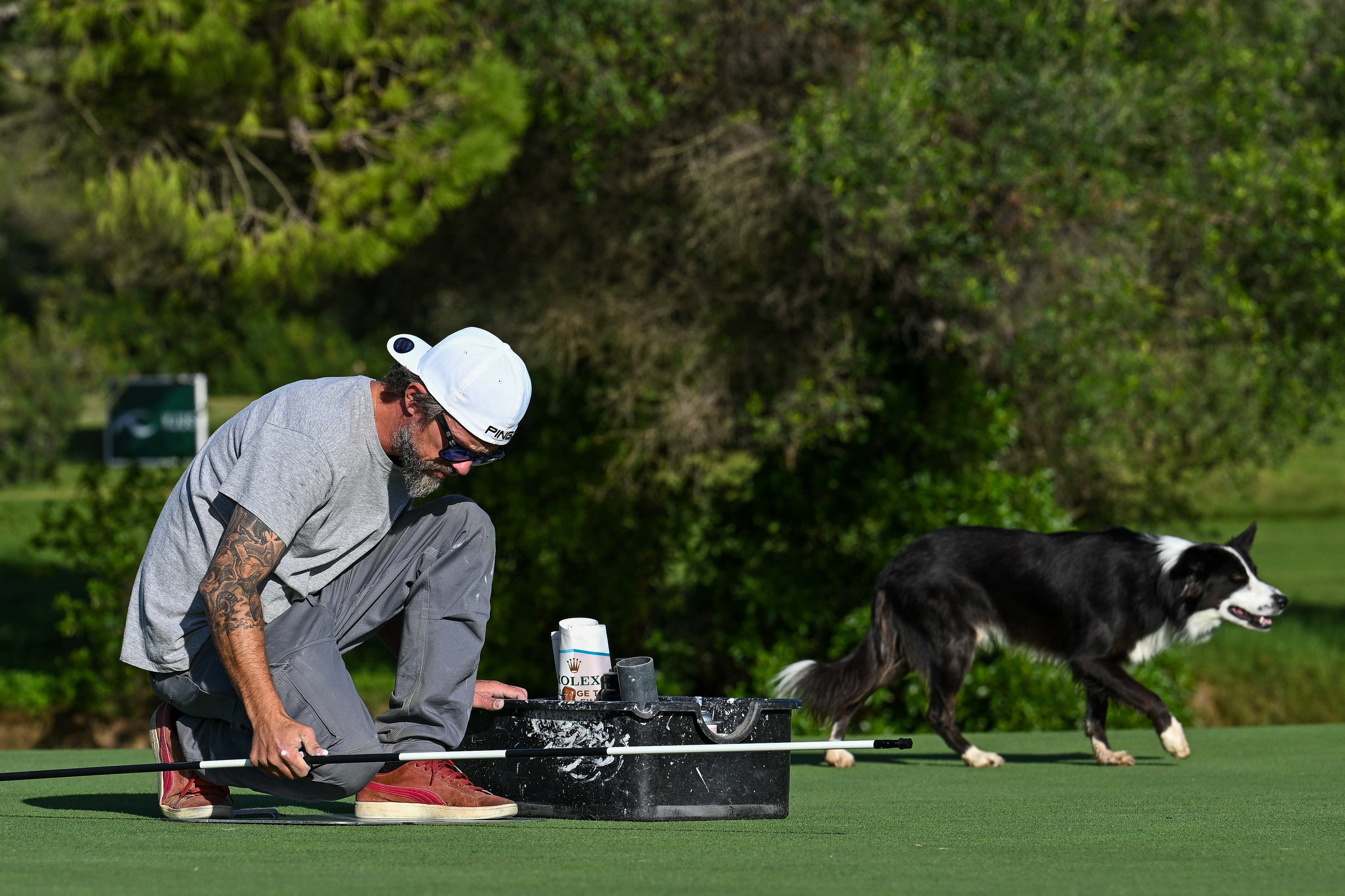 A greenkeeper completes work at Club de Golf Alcanada ahead of the 2023 Challenge Tour Grand Final