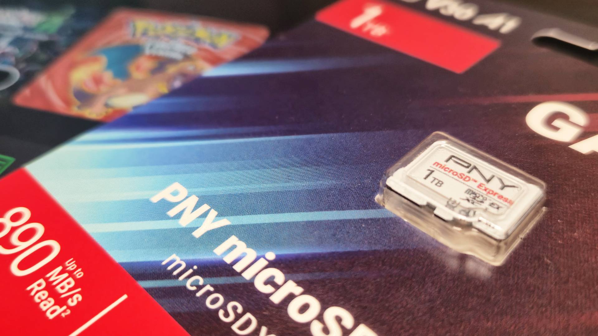 Photo of the 1TB PNY Switch 2 microSD Express card sitting on top of the handheld.
